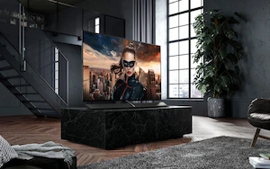 Living room with flatscreen TV showing a movie